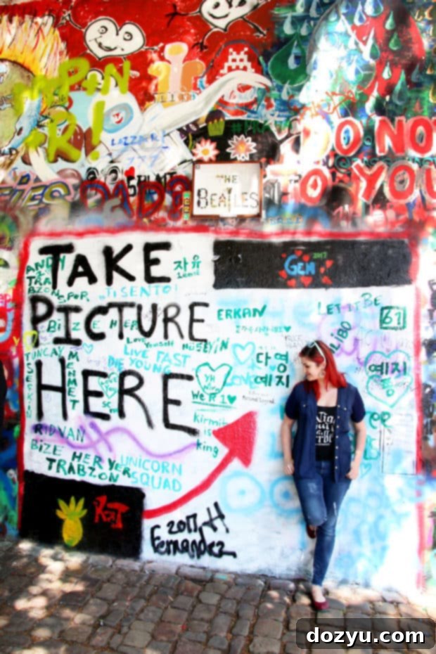 Vibrant and colorful Lennon Wall in Prague, covered in graffiti and art