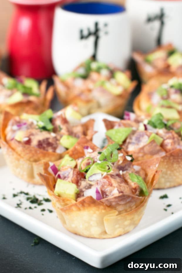 Spicy Tuna Avocado Wonton Poppers 6 Platter of Spicy Tuna Poke Wonton Cups garnished with fresh cilantro, ready to serve as a party appetizer.
