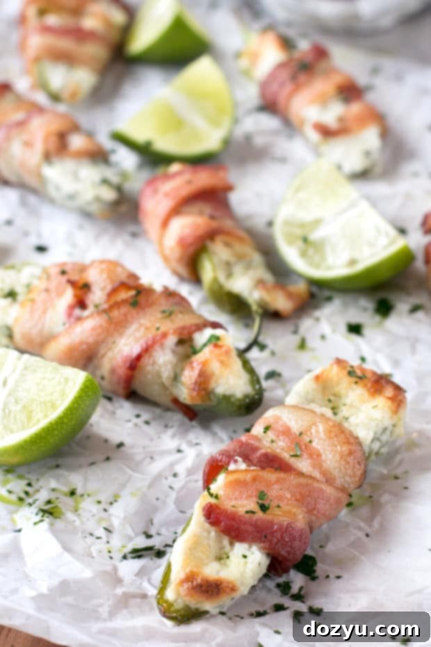 Delicious Goat Cheese Stuffed Bacon Wrapped Jalapeños, perfect for tailgating with Cypress Grove cheese.