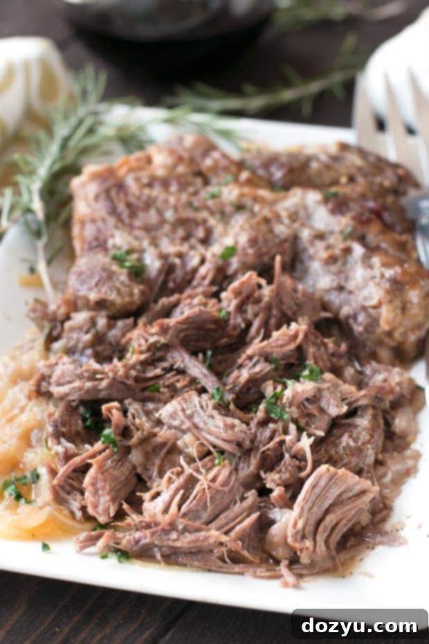 Slow Cooker Garlic Rosemary Pot Roast with Red Wine Sauce | cakenknife.com #ad #roastwiththemost #potroast #crockpot