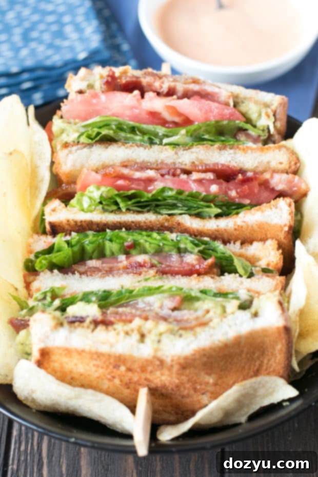 Blazing Bliss BLAT Tower 4 Side view of the Double Decker BLAT, highlighting the thick spicy candied bacon and the middle fried bread layer. A gourmet take on a classic BLT. #lunch #sandwich #bacon #homemade