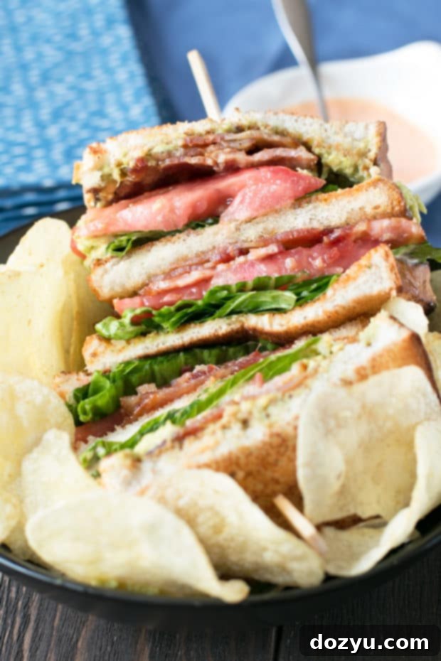 Blazing Bliss BLAT Tower 6 Serving suggestion for the Double Decker BLAT, cut in half to show all the layers clearly. A perfect lunch or light dinner option. #lunch #sandwich #bacon #homemade