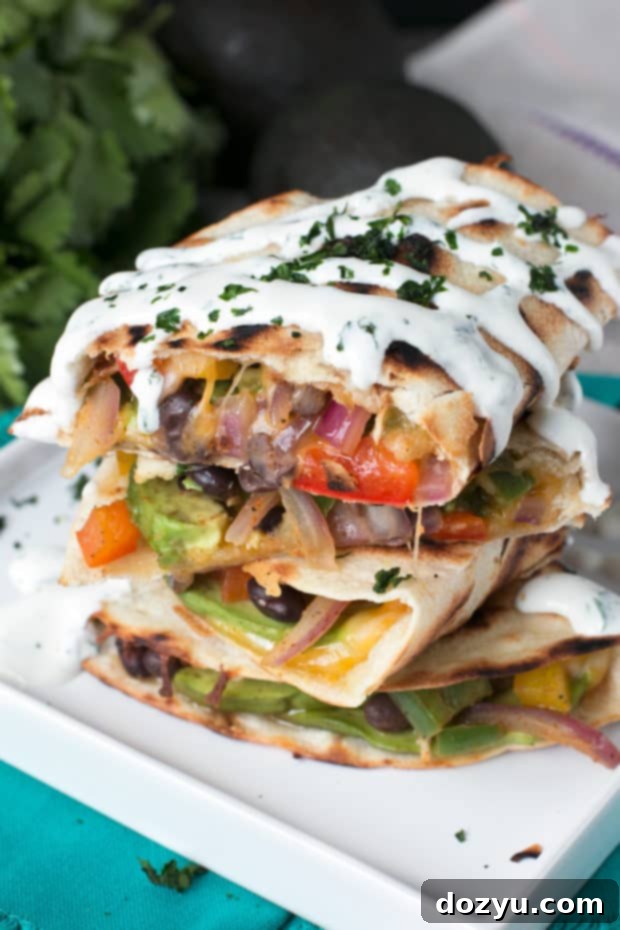 Delicious Veggie Avocado Quesadilla with Cilantro Crema, ready to be served