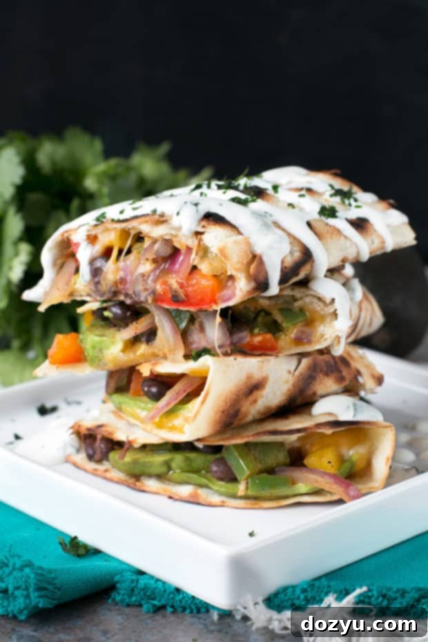 Close-up of a freshly made Veggie Avocado Quesadilla with cilantro garnish