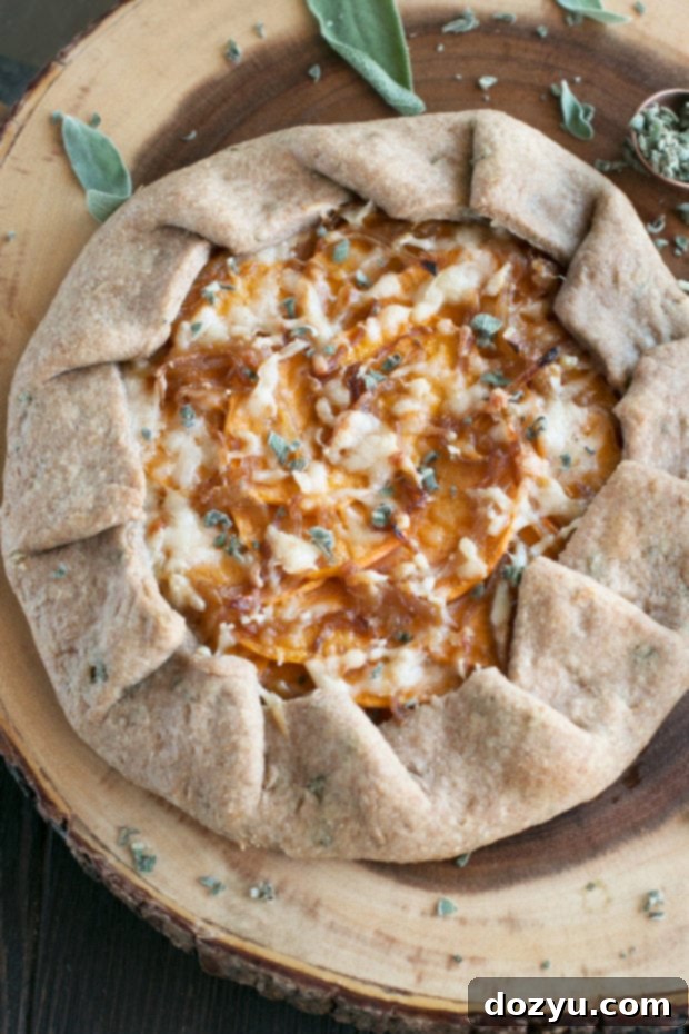 A close-up of the Whole Wheat Asiago Sweet Potato Galette, showing the crispy whole wheat crust and sweet potato filling, perfect for a Thanksgiving side.