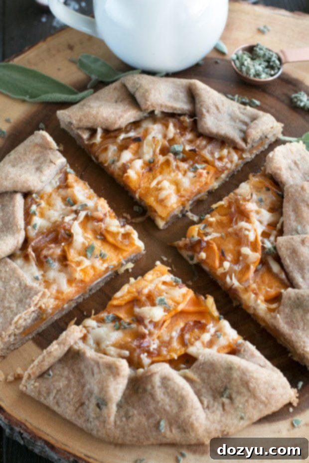 Preparing the Whole Wheat Asiago Sweet Potato Galette, showing the rustic edge of the crust before baking.