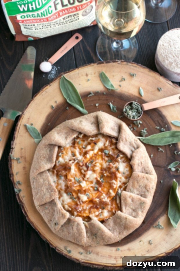 A serving of Whole Wheat Asiago Sweet Potato Galette on a plate, ready to be enjoyed as a holiday appetizer or side dish.