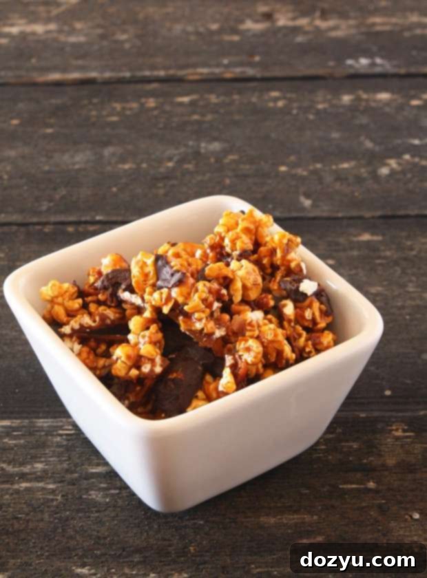 Crispy Bacon Chocolate Caramel Corn close-up on a wooden board