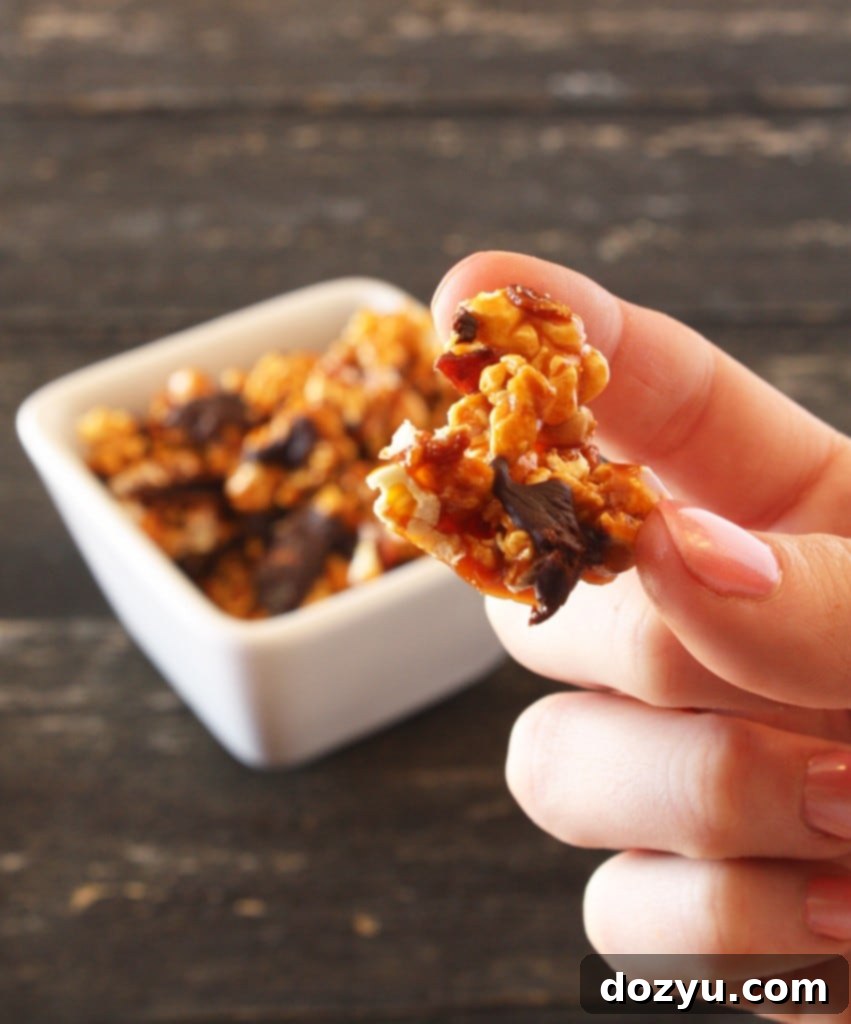 Bacon Chocolate Caramel Corn spread out on a baking sheet