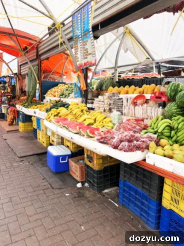 Bustling Floating Market in Willemstad, Curaçao with colorful boats