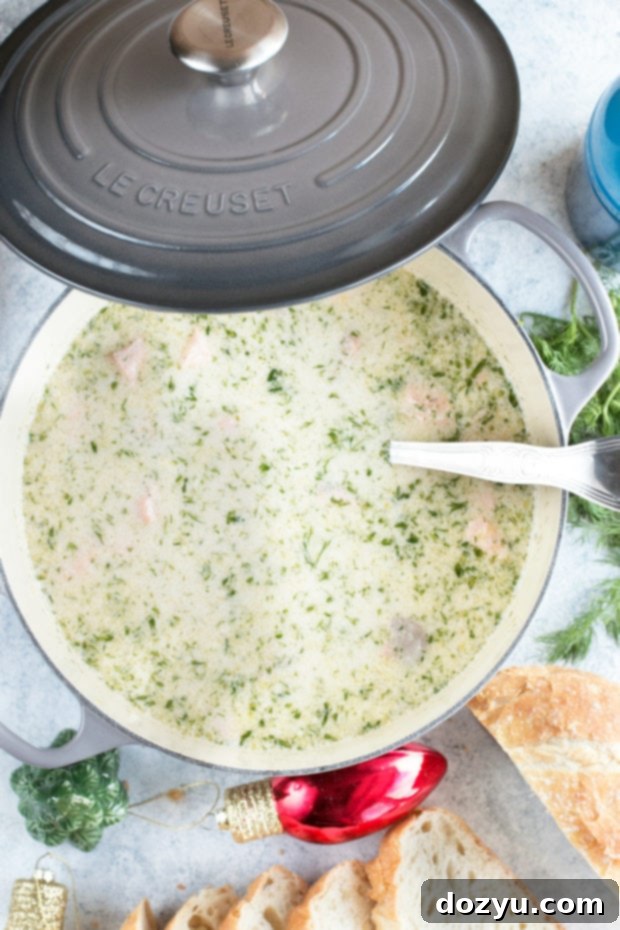Close-up of a bowl of creamy Salmon Chowder, garnished with fresh dill, ready for a cozy meal. #salmonchowder #comfortfood #holidayrecipe