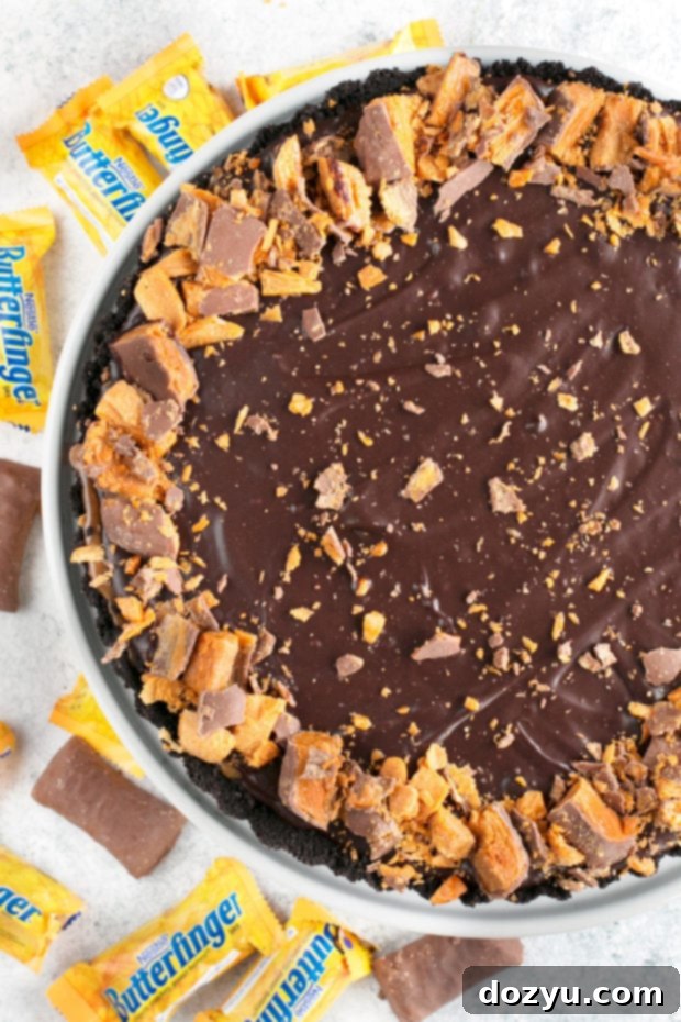 Easy Butterfinger Caramel Ganache Tart sliced and ready to serve
