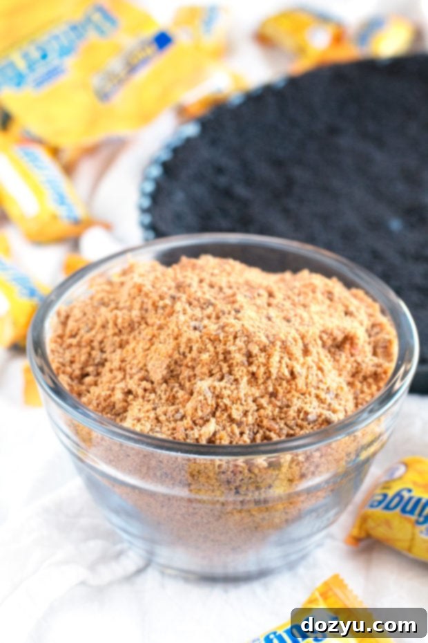 Close-up of the Butterfinger Caramel Ganache Tart showing the layers