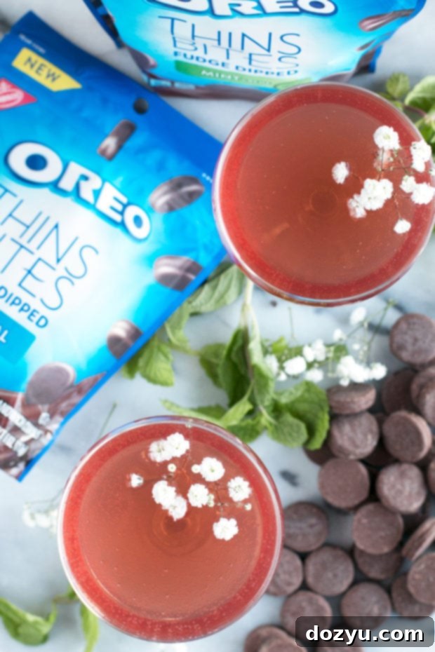 Refreshing Sparkling Mint Rose Wine Cocktail with vibrant mint leaves and a delicate rose hue.