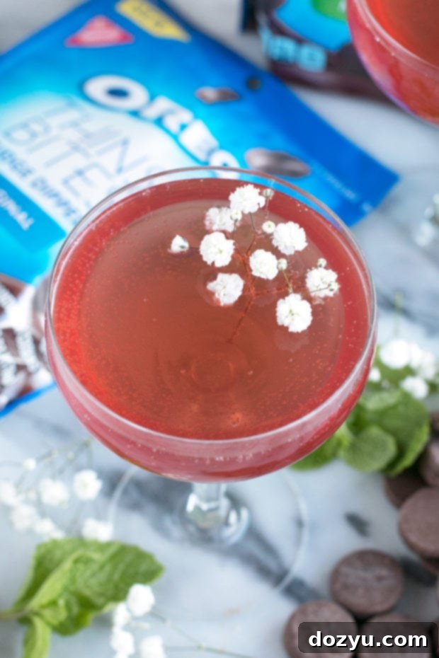 A refreshing Sparkling Mint Rose Wine Cocktail with mint garnish and OREO Thins Bites.