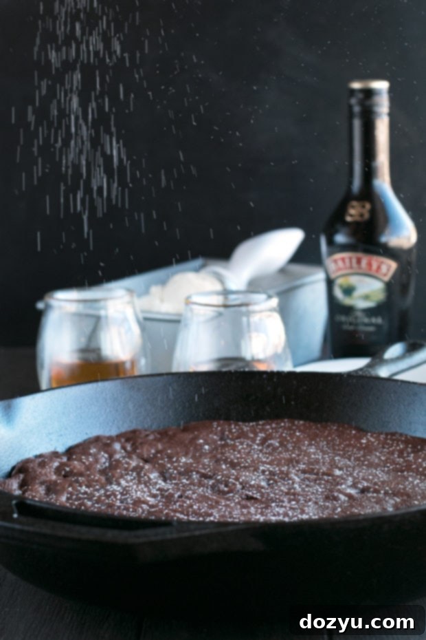 Whiskey Brownie Skillet Baileys Ice Cream Indulgence 5 A slice of Whiskey Skillet Brownie showing its fudgy texture and rich dark chocolate