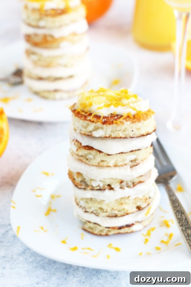 Mimosa Pancake Stacks ready to be served on a white plate