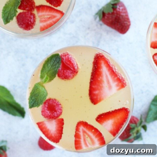 Effortless Bubbly Berry Sangria 9 Easy Champagne Sangria with berries and mint