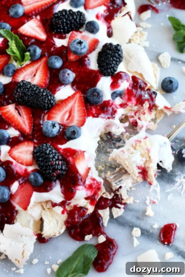 Crushed Berry Cloud Pavlova 9 Berry dessert with a fork