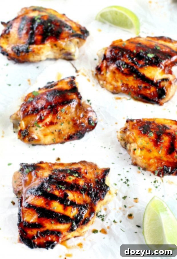 Platter of freshly grilled Tequila Lime Chicken Thighs garnished with cilantro