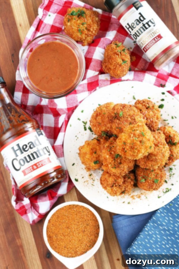 BBQ Fried Mac & Cheese Balls 2 Crispy golden BBQ Fried Mac N Cheese Balls piled high on a plate, ready to be served.