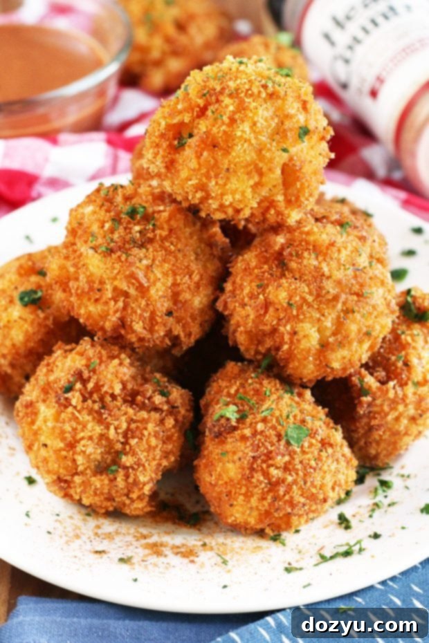 BBQ Fried Mac & Cheese Balls 4 A serving of BBQ Fried Mac N Cheese Balls with a bowl of blue cheese dipping sauce.