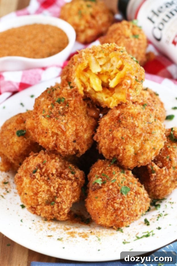 BBQ Fried Mac & Cheese Balls 6 BBQ Fried Mac N Cheese Balls arranged around a bowl of BBQ blue cheese sauce.