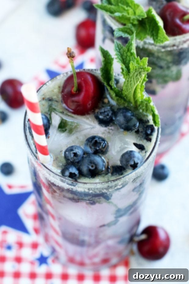 Finished Cherry Blueberry Mojito with striped straws