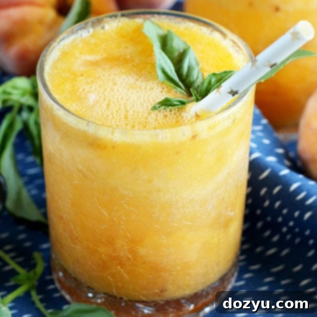 Warm Nectar Gin Sparkle 9 Roasted Peach Gin Fizz cocktail in a stylish glass