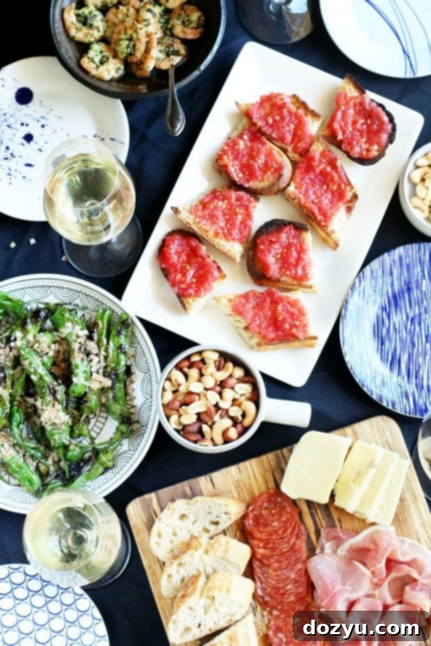 Beginning Your Tapas Bash From Scratch 2 How To Host A Tapas Party Entertaining Guide with various tapas dishes laid out