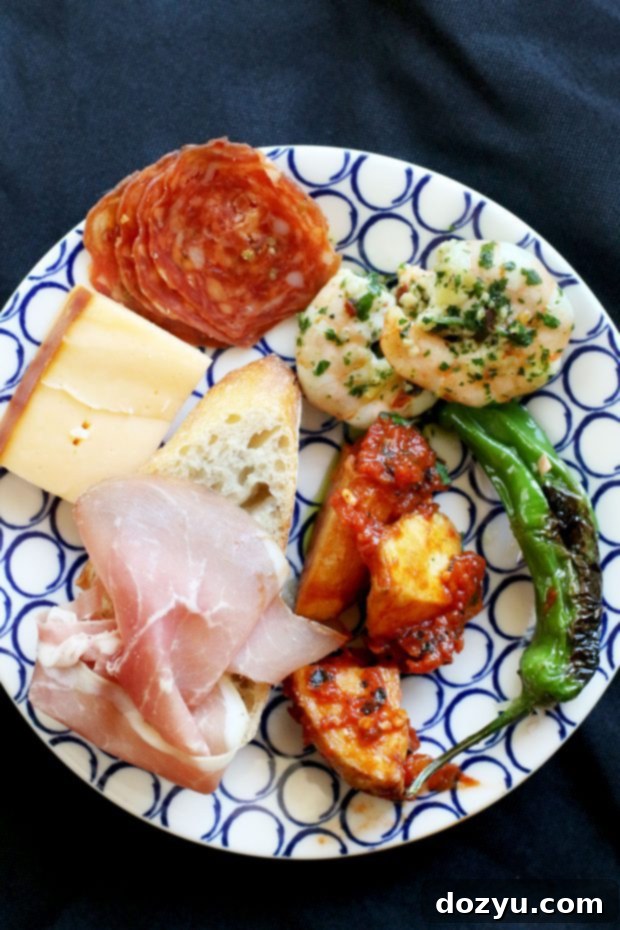Beginning Your Tapas Bash From Scratch 6 Small elegant bowls filled with different tapas dishes