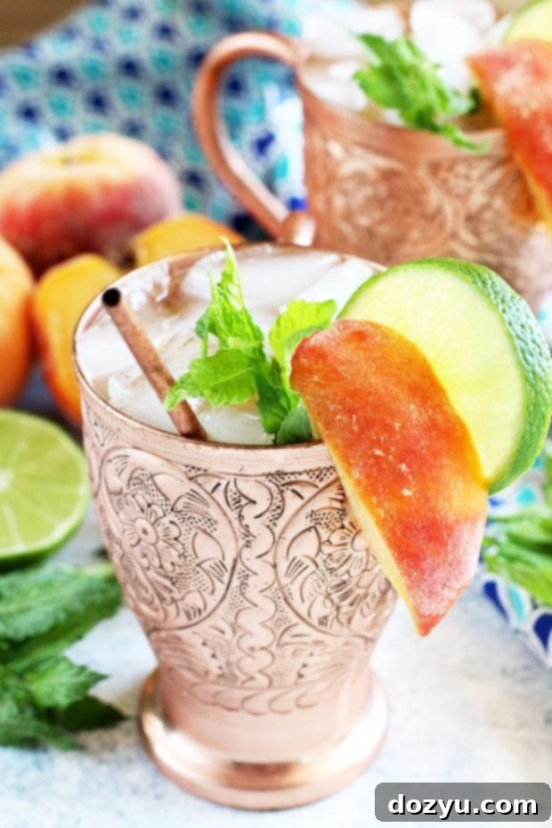 Signature Peach Mint Mule 6 Refreshing Peach Mint Moscow Mule garnished with fresh mint and peach slices
