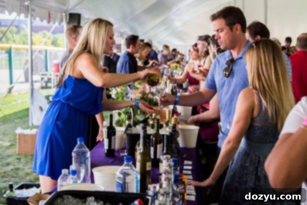 Guests enjoying the vibrant atmosphere at the Denver Food + Wine Festival, a key event in Denver's culinary calendar.