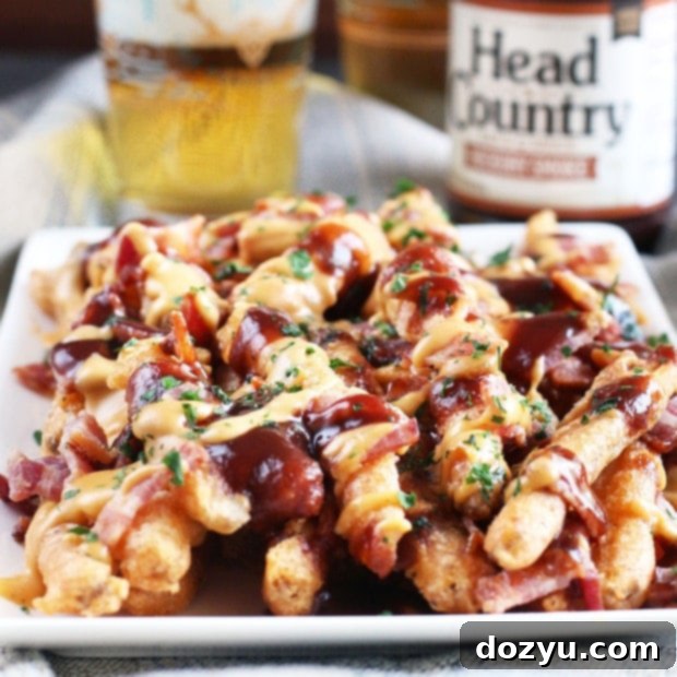 Addictive BBQ Bacon Fries 11 BBQ Bacon Crack Fries with fresh parsley garnish