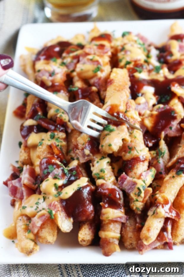 Addictive BBQ Bacon Fries 4 Overhead shot of a platter of BBQ Bacon Crack Fries, perfect for sharing