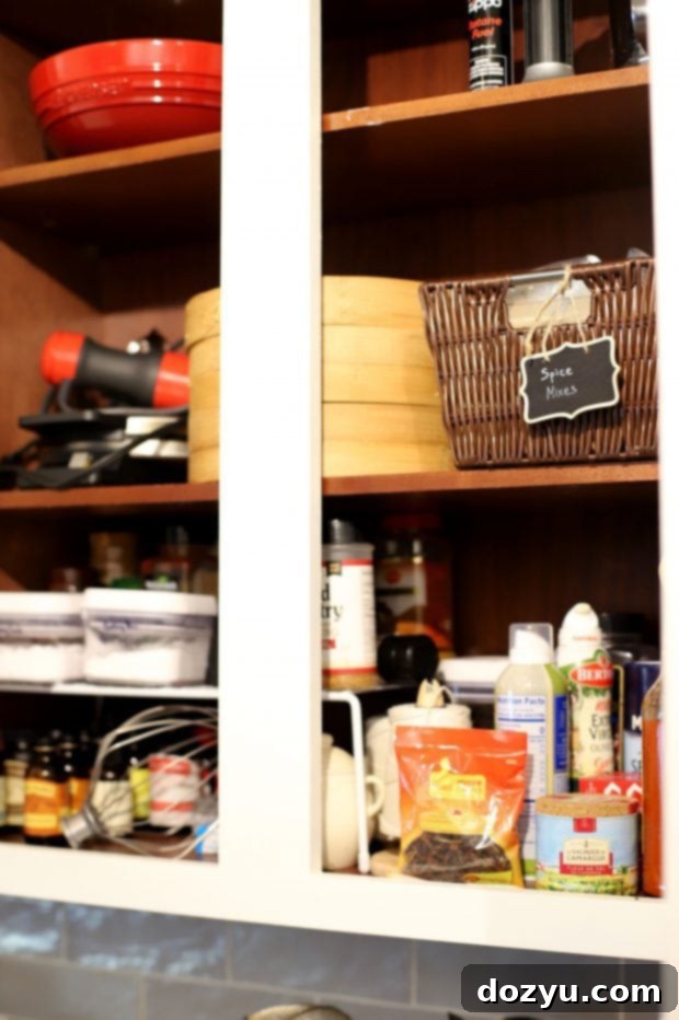 Simplify Your Kitchen: 5 Quick Organization Hacks 15 Happy woman in a newly organized kitchen