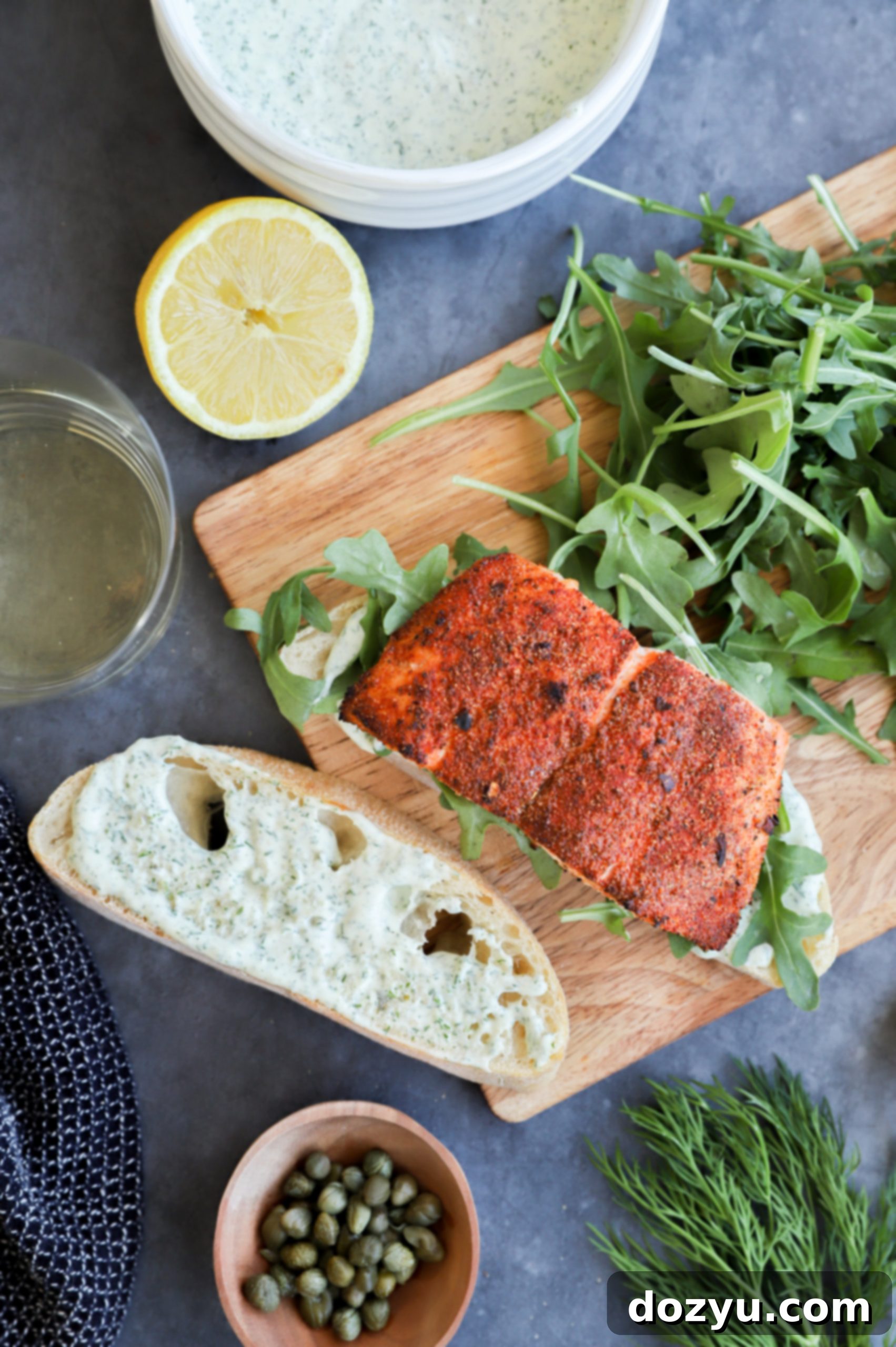 Elevated Salmon Sandwich with Herbed Dill Cream 11 Overhead image of a delightful seafood spring dinner spread