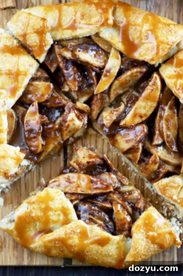 Bourbon-Kissed Caramel Apple Galette 4 Sliced Bourbon Caramel Apple Galette with generous bourbon caramel drizzle