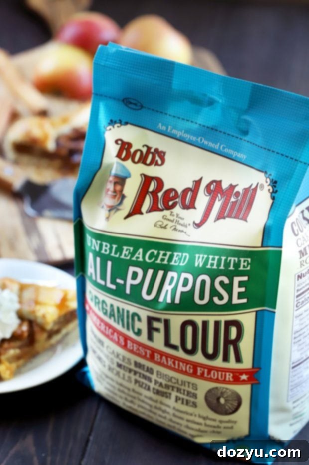 Bourbon-Kissed Caramel Apple Galette 7 Bag of Bob's Red Mill Organic All-Purpose Unbleached White Flour next to a galette