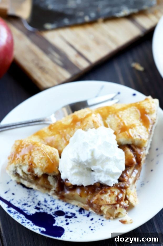 Bourbon-Kissed Caramel Apple Galette 10 Overhead shot of Bourbon Caramel Apple Galette with ice cream scoop