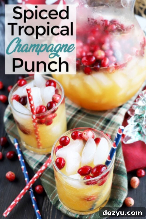 Pin this Spiced Tropical Holiday Champagne Punch recipe for later - a beautiful image suitable for Pinterest saving.