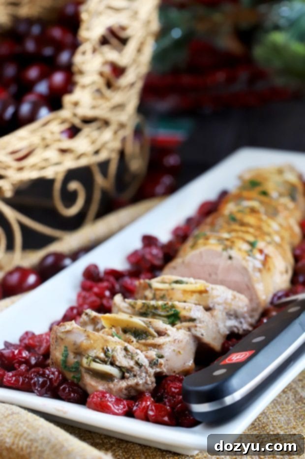 Succulent Roasted Garlic Pork Tenderloin with Cranberries, perfect for a holiday feast