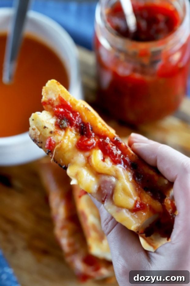 Inverted French Baguette Grilled Cheese with luscious melted cheese and a generous spread of tomato jalapeño jam