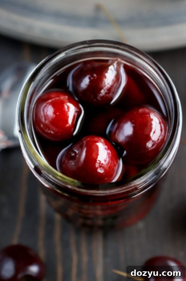 Homemade Brandy Cherries served with a cocktail