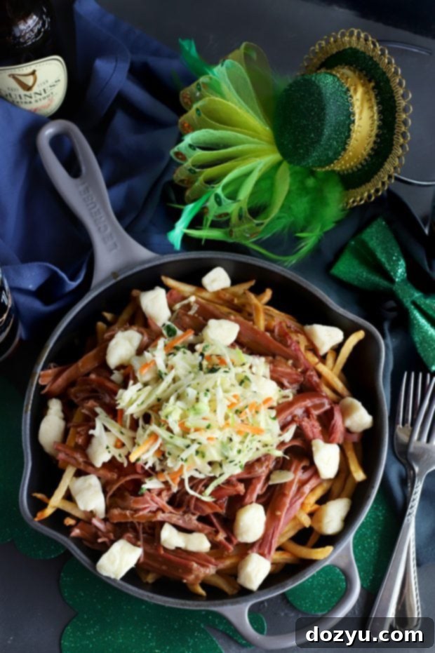 Hearty Corned Beef Poutine 2 Corned Beef Poutine, a hearty Irish-Canadian fusion dish with crispy fries, tender corned beef, rich Guinness gravy, and melting cheese curds.