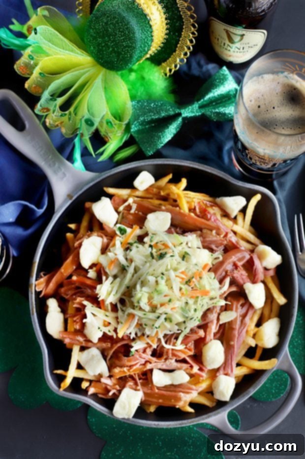 Hearty Corned Beef Poutine 5 A plate of Corned Beef Poutine, showcasing the golden fries, chunks of corned beef, and luscious gravy.