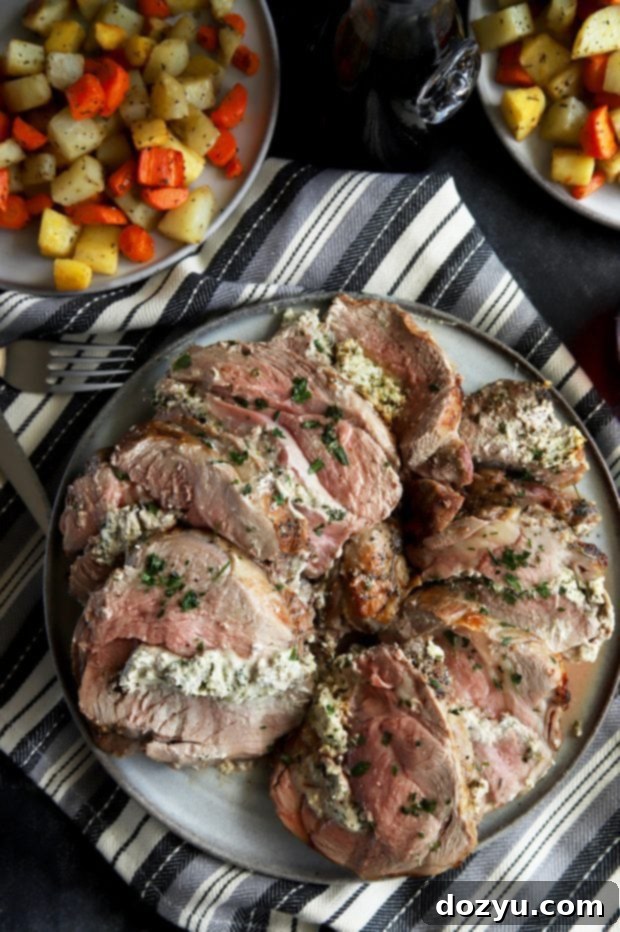 Roasted Leg of Lamb with Herbed Goat Cheese Stuffing 4 Sliced stuffed leg of lamb with vegetables