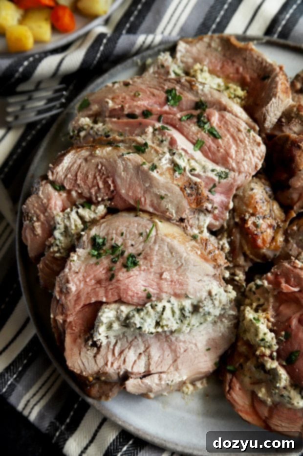 Roasted Leg of Lamb with Herbed Goat Cheese Stuffing 6 Stuffed leg of lamb on a platter