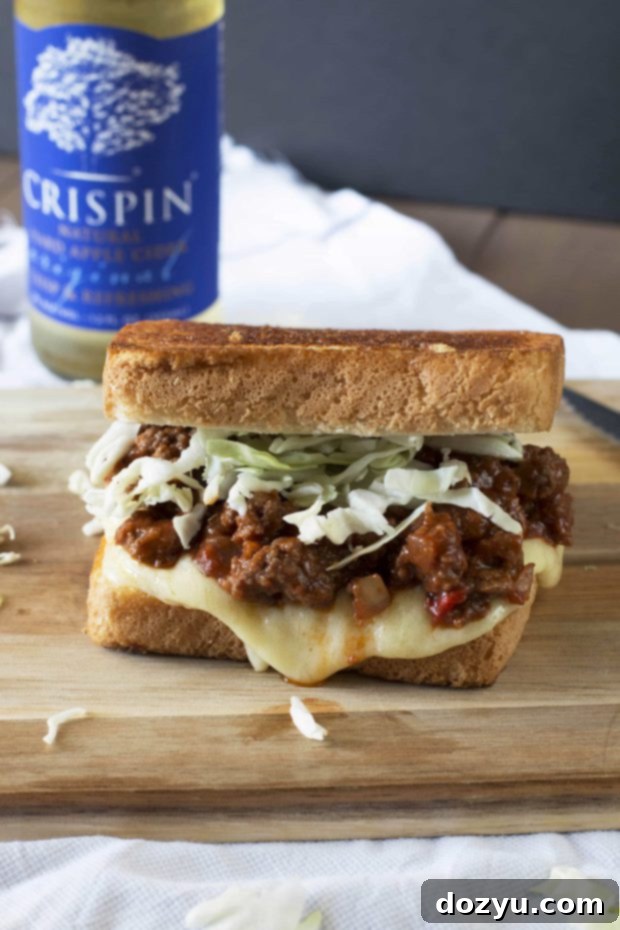 Cheesy Sloppy Joe Melt 2 Delicious Sloppy Joe Grilled Cheese sandwich, showing a cross-section of its layers