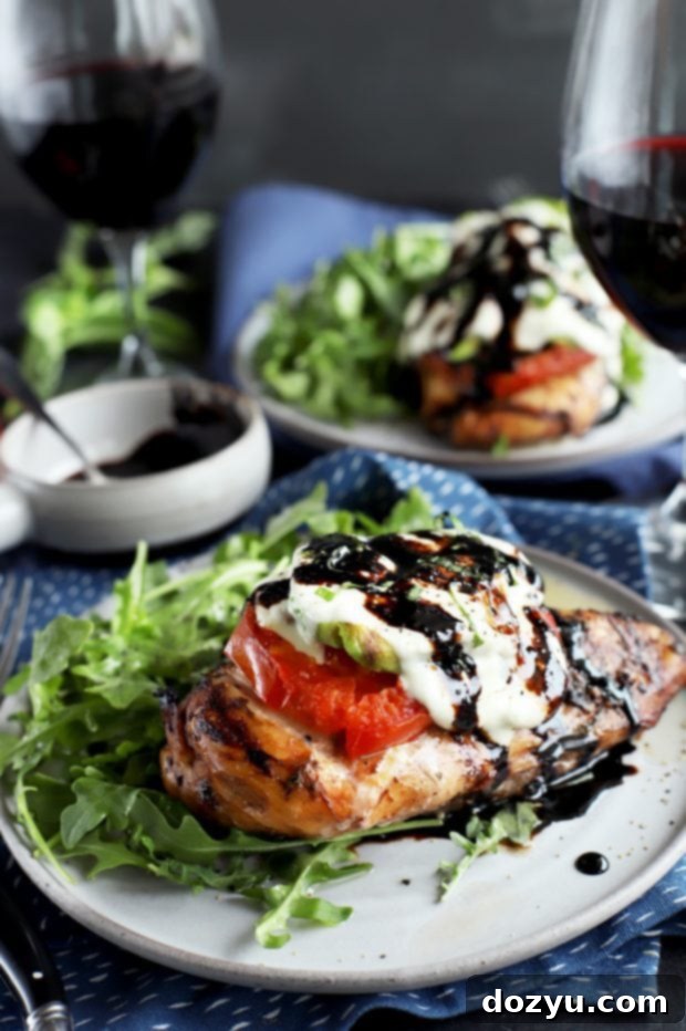 Easy grilled avocado caprese chicken for dinner, drizzled with balsamic glaze
